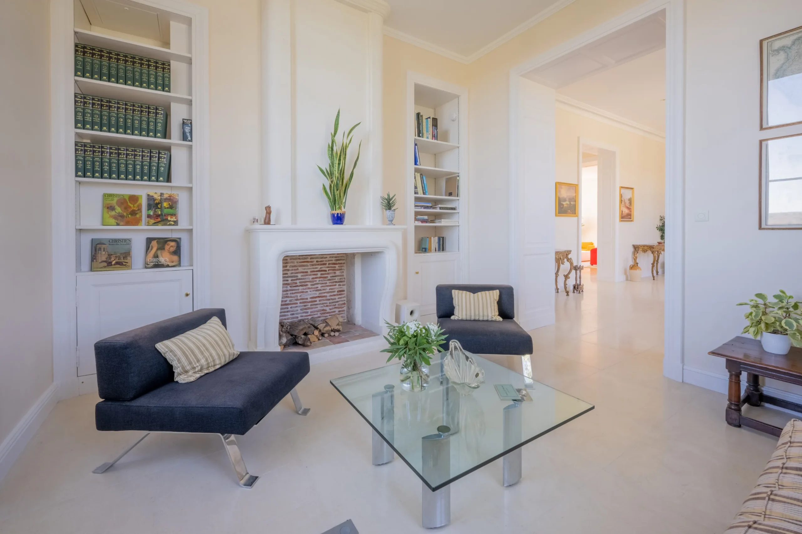 Cozy up by the fireplace with a book from the Château's library