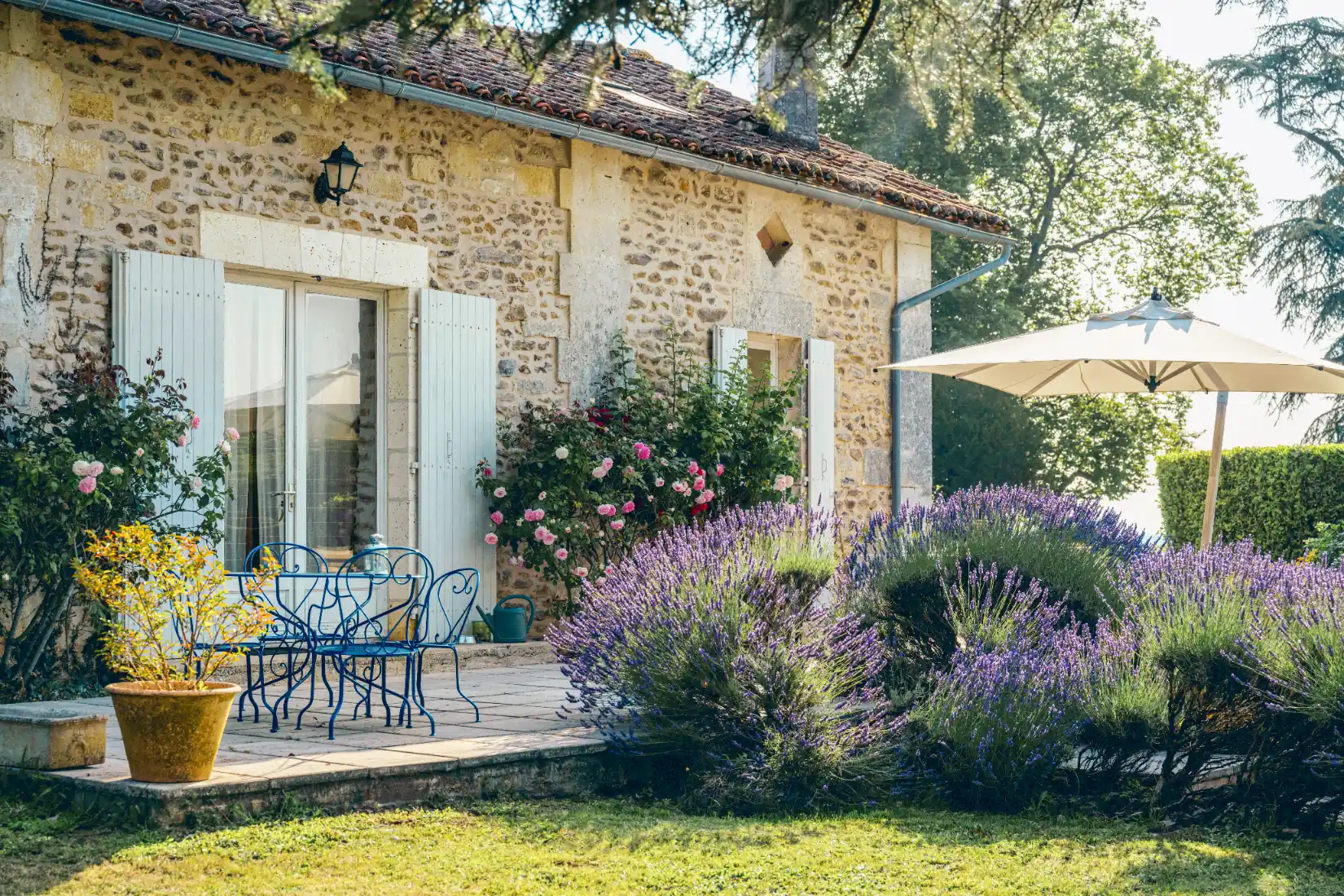 Stone cottage with outdoor seating and lavender garden