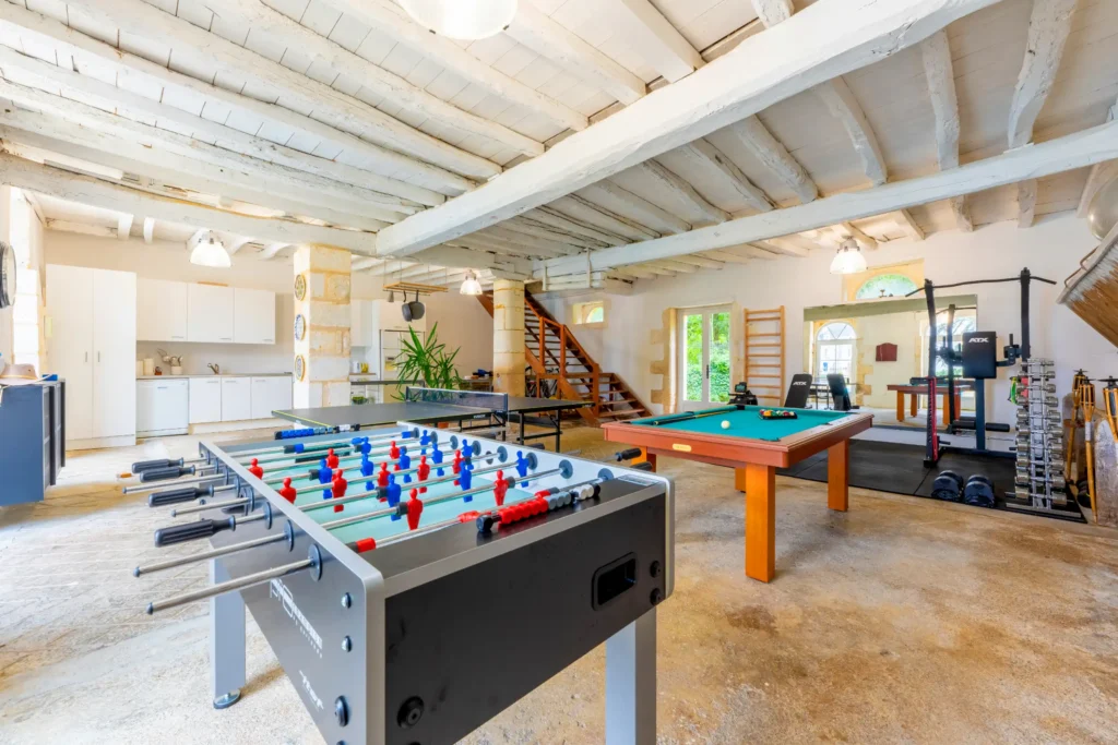 Foosball table in a bright and airy recreational space