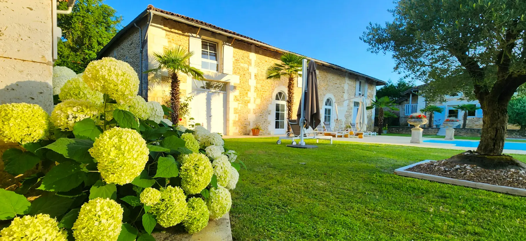 Stone house with hydrangeas