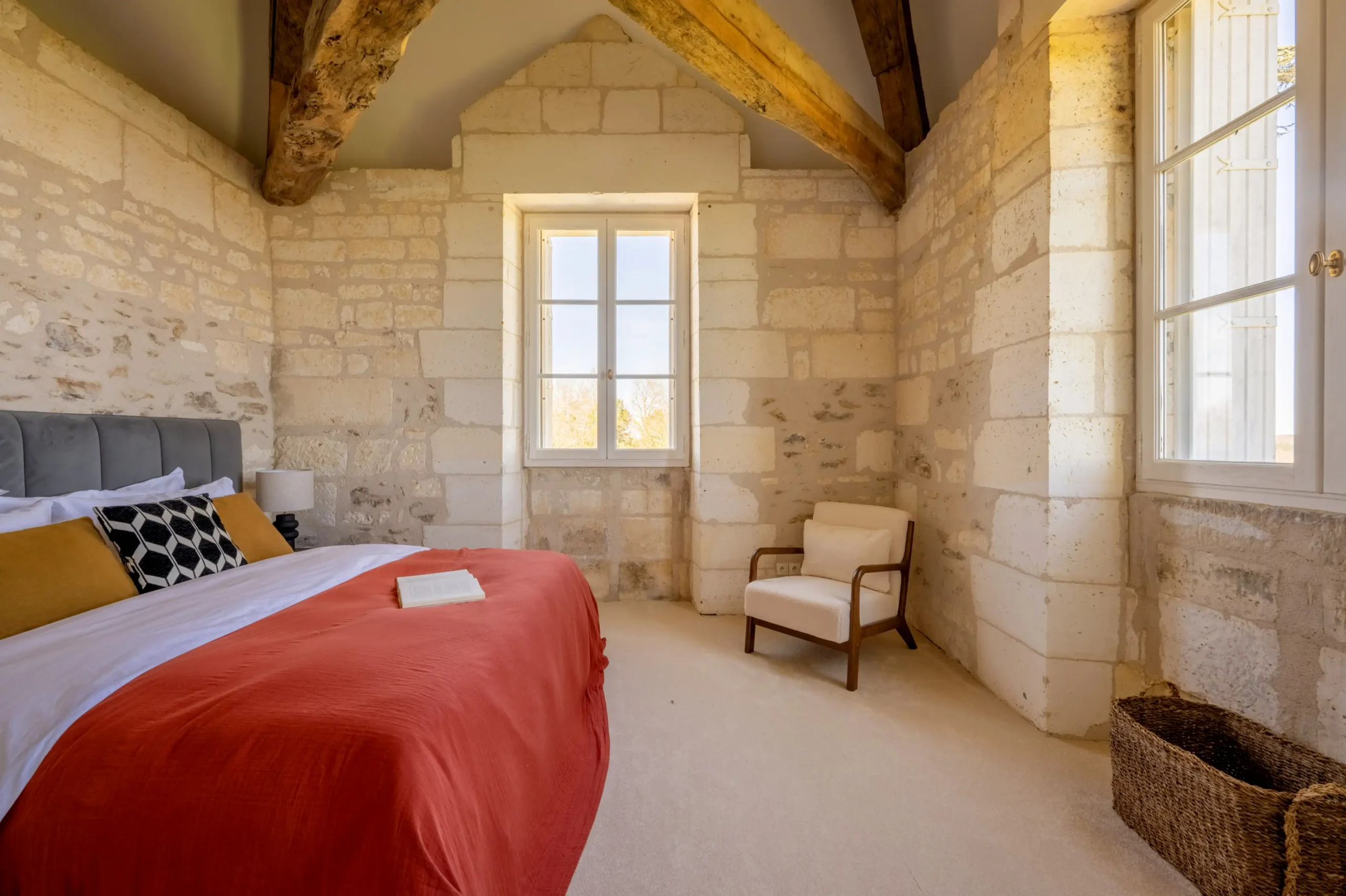 Comfortable king-size bed with classic furnishings and warm lighting