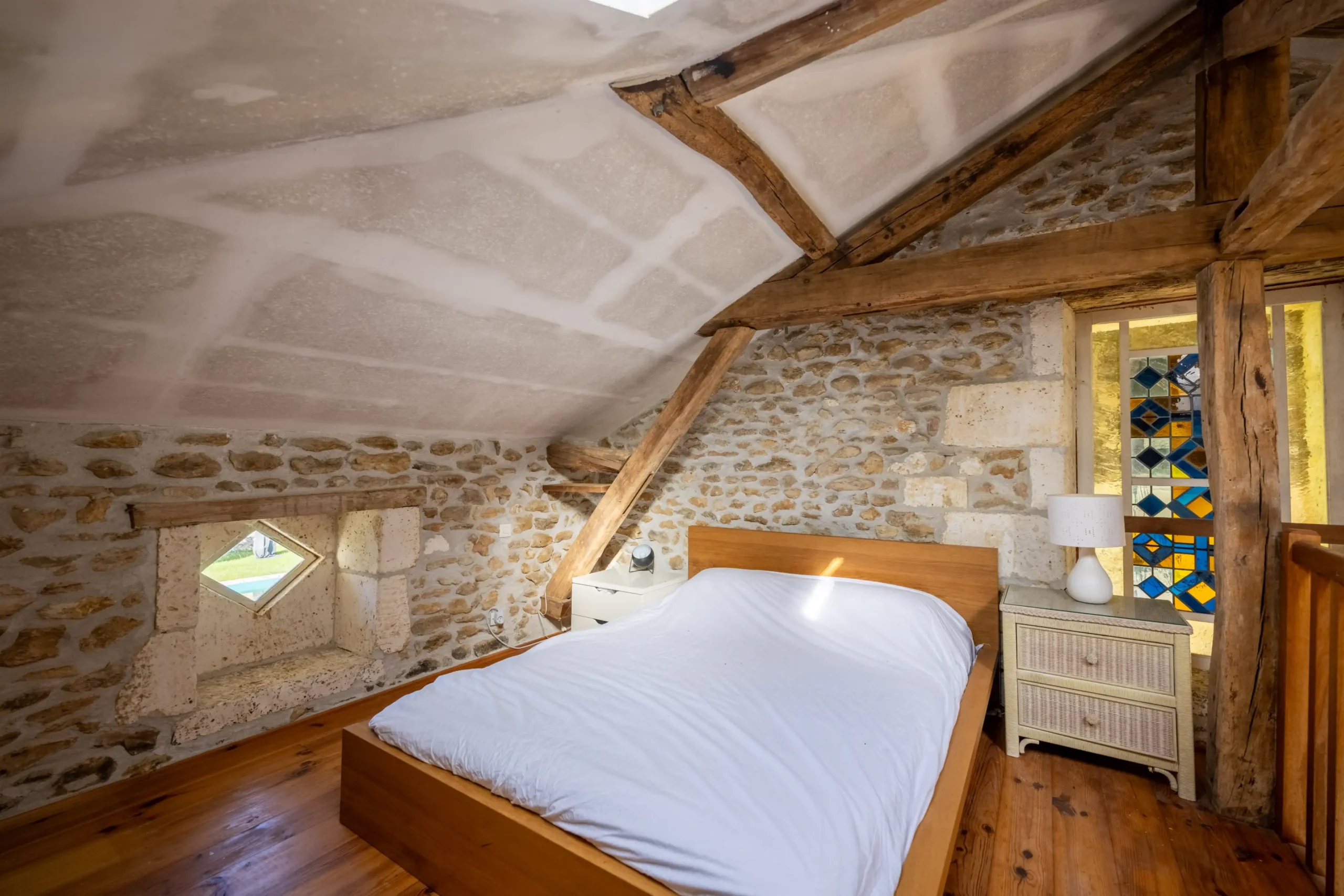 Outdoor sitting area with garden view at Loft Gite