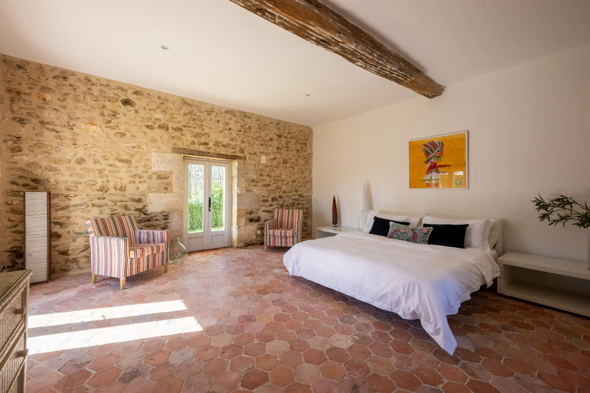 King-size bed and 55-inch TV in Pool Gite bedroom