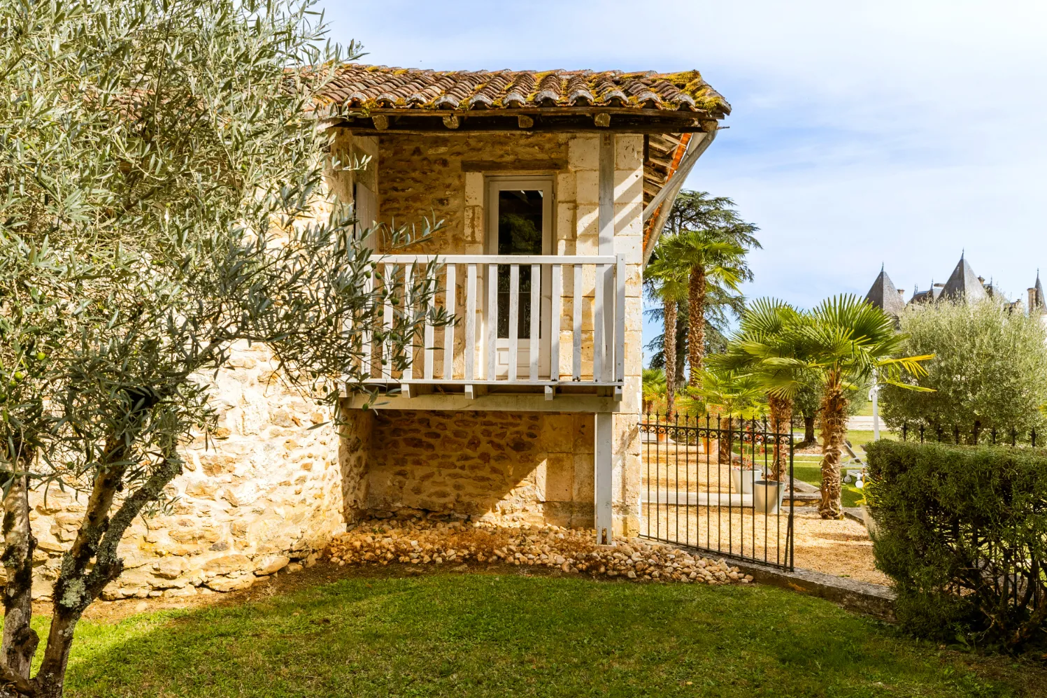 Rustic stone house with a small wooden balcony