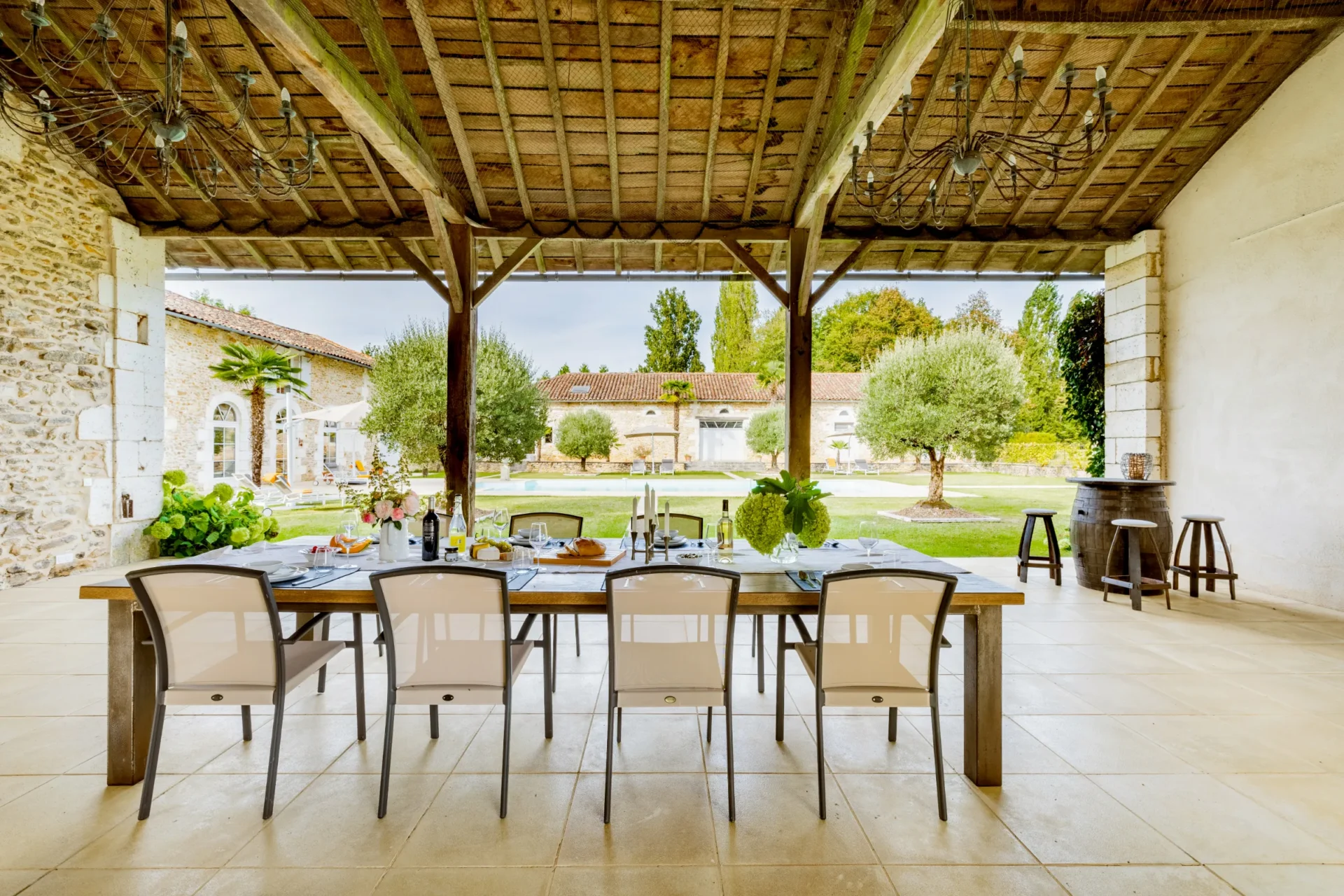Rustic open-air dining space with a scenic garden view