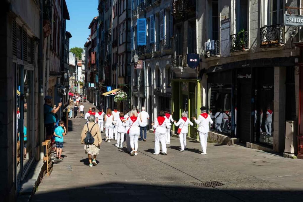 A traditional Basque music band plays music through the streets of the town centre