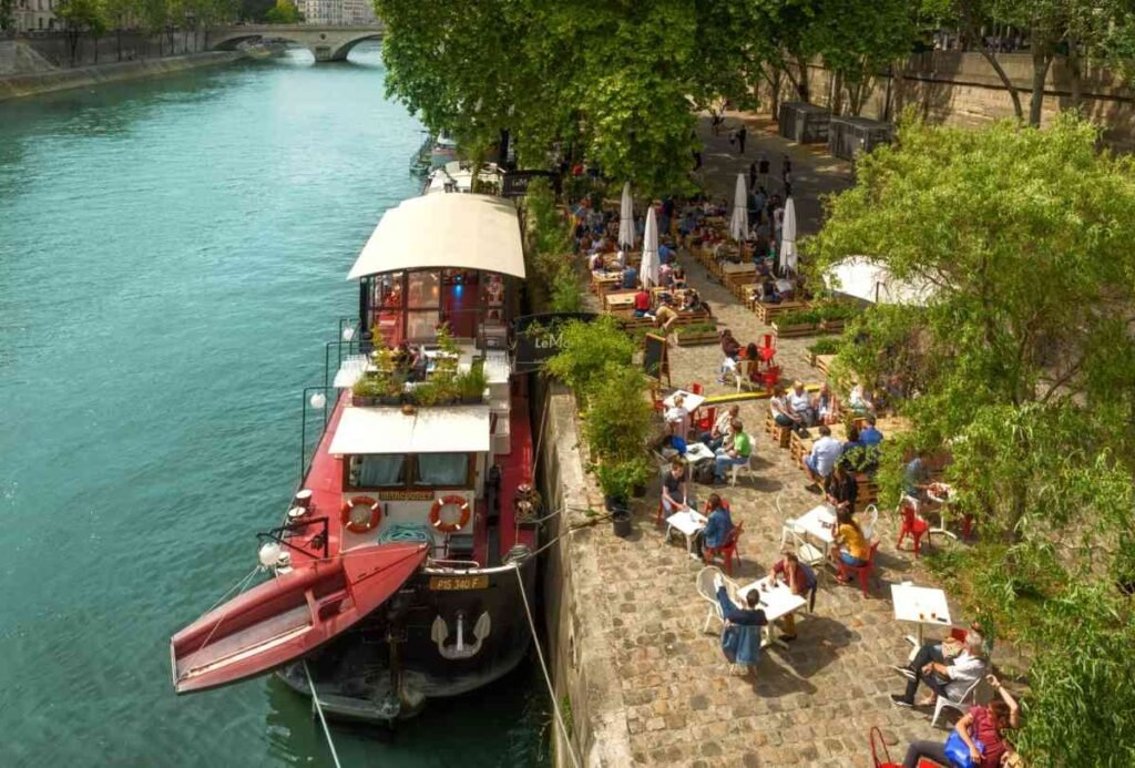 Boat restaurant in summer on Seine river in Paris